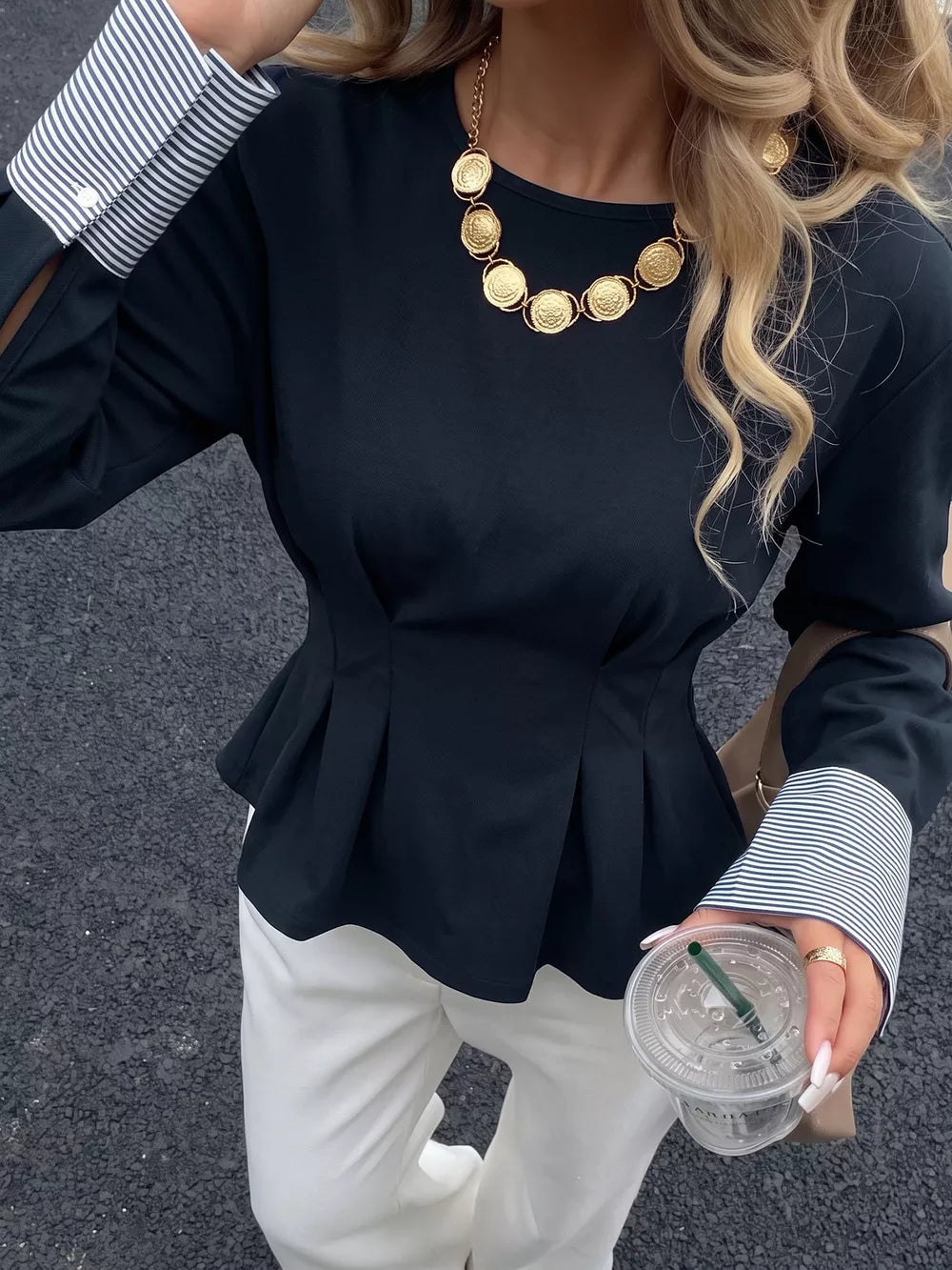 95% polyester, 5% elastane Care instructions: Machine wash cold peplum top in navy blue with fitted silhouette