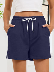 Navy heathered jogger shorts with white drawstring and sporty side trim.