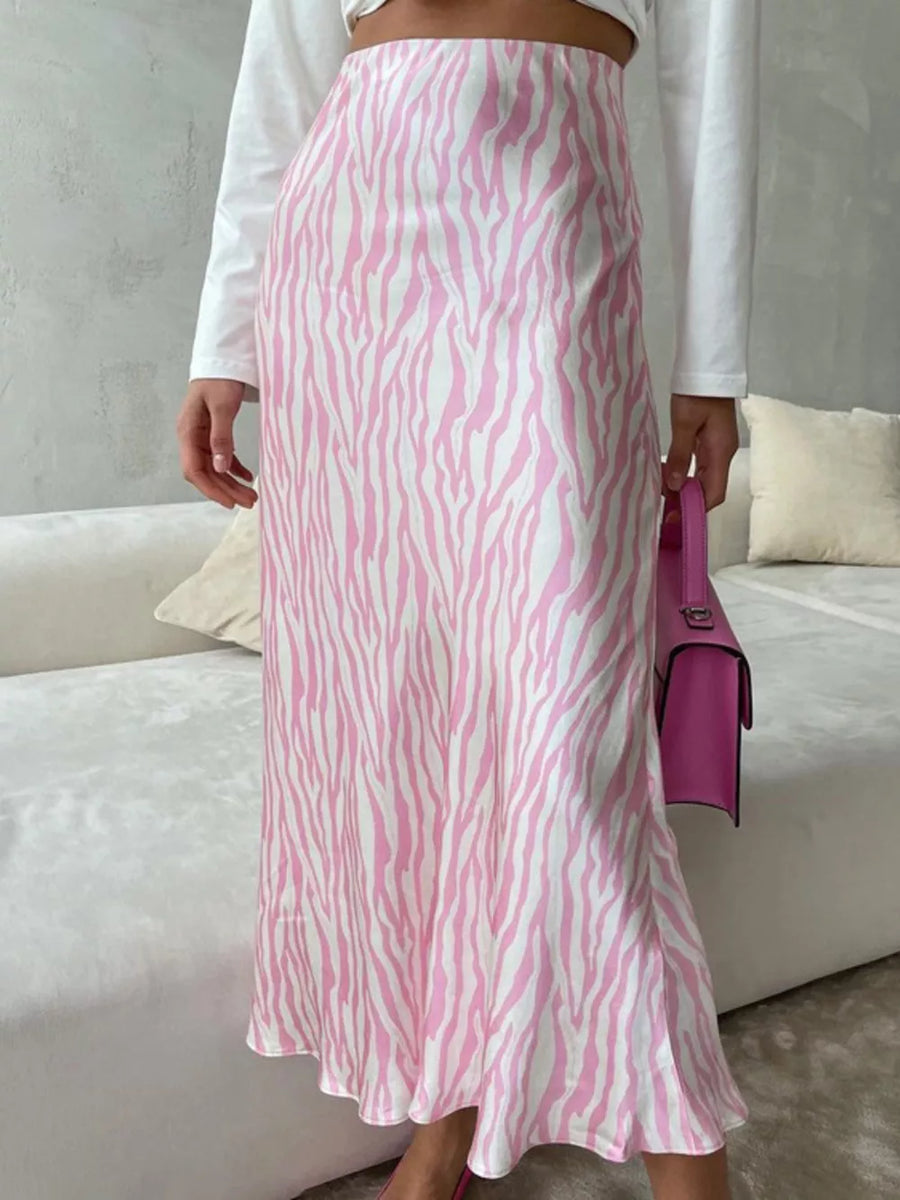 Pink and white zebra print satin midi skirt with a high waist and slight flare.