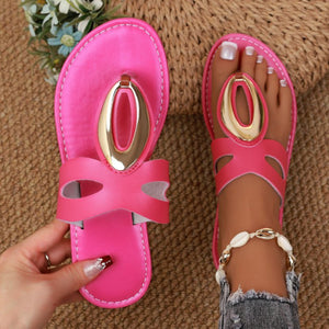 Chic open-toe sandals in rose red with golden oval accent and contrast stitching.