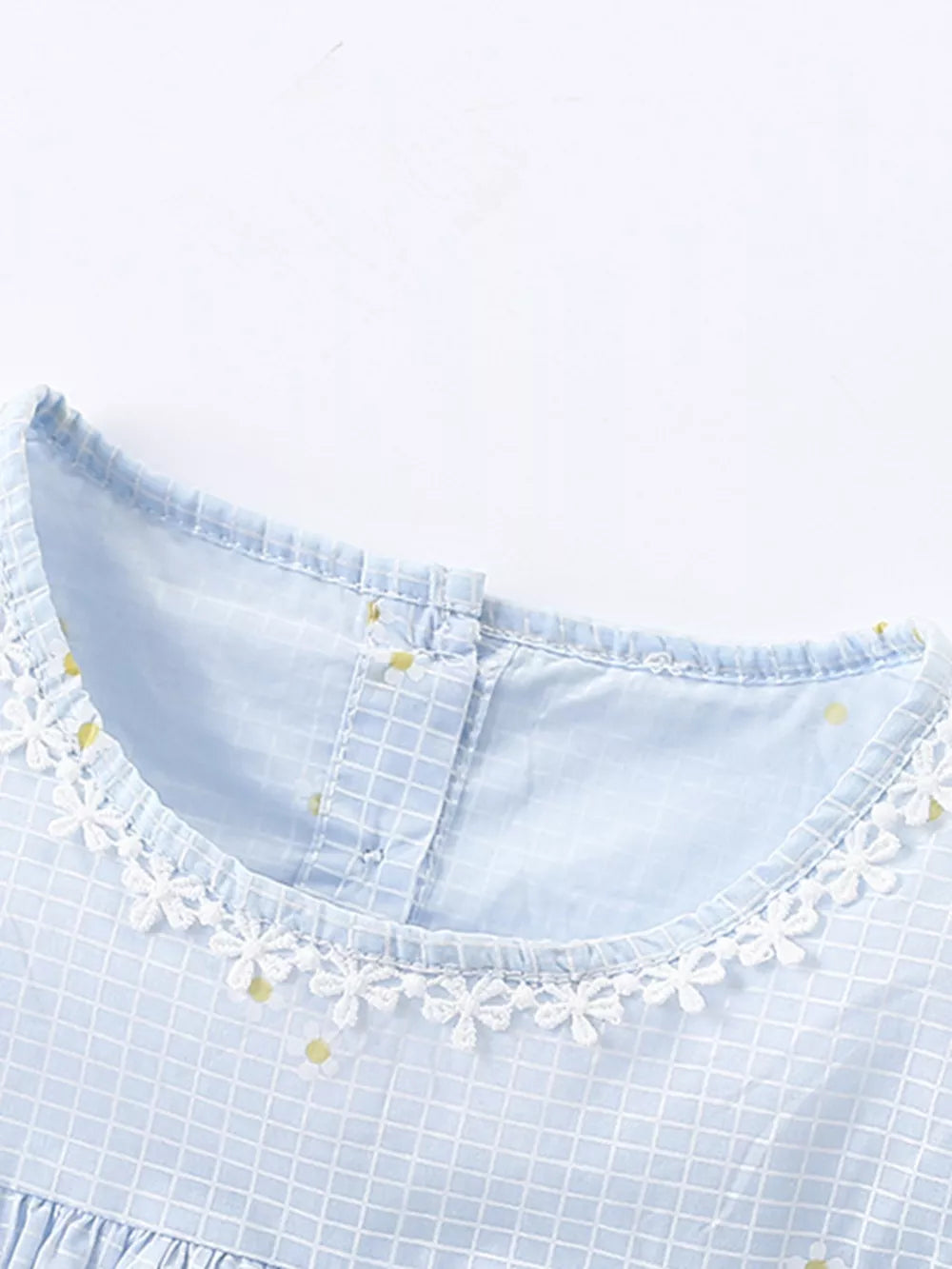 Baby dress with blue gingham, yellow dots, and white lace trim.