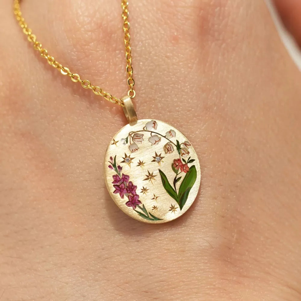 gold necklace with floral and n/a