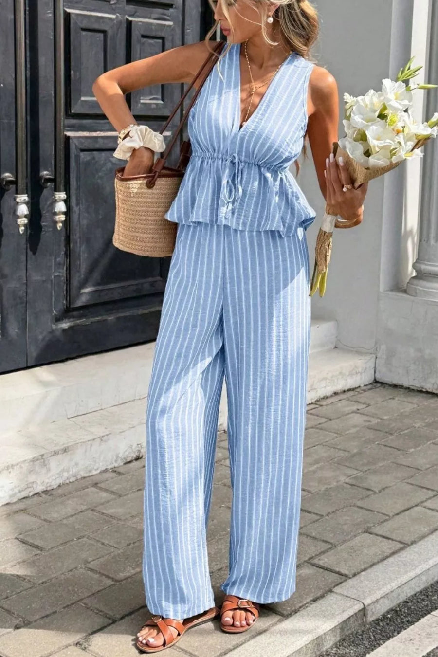 Light blue striped two-piece set with peplum top and wide-leg pants