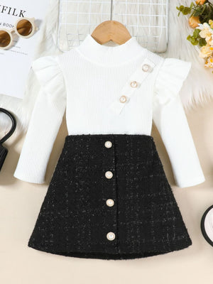 White ruffle sleeve top with pearl buttons and black tweed A-line skirt set.