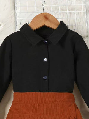 Toddler black button-up shirt with flounce sleeves and apricot brown corduroy skort.