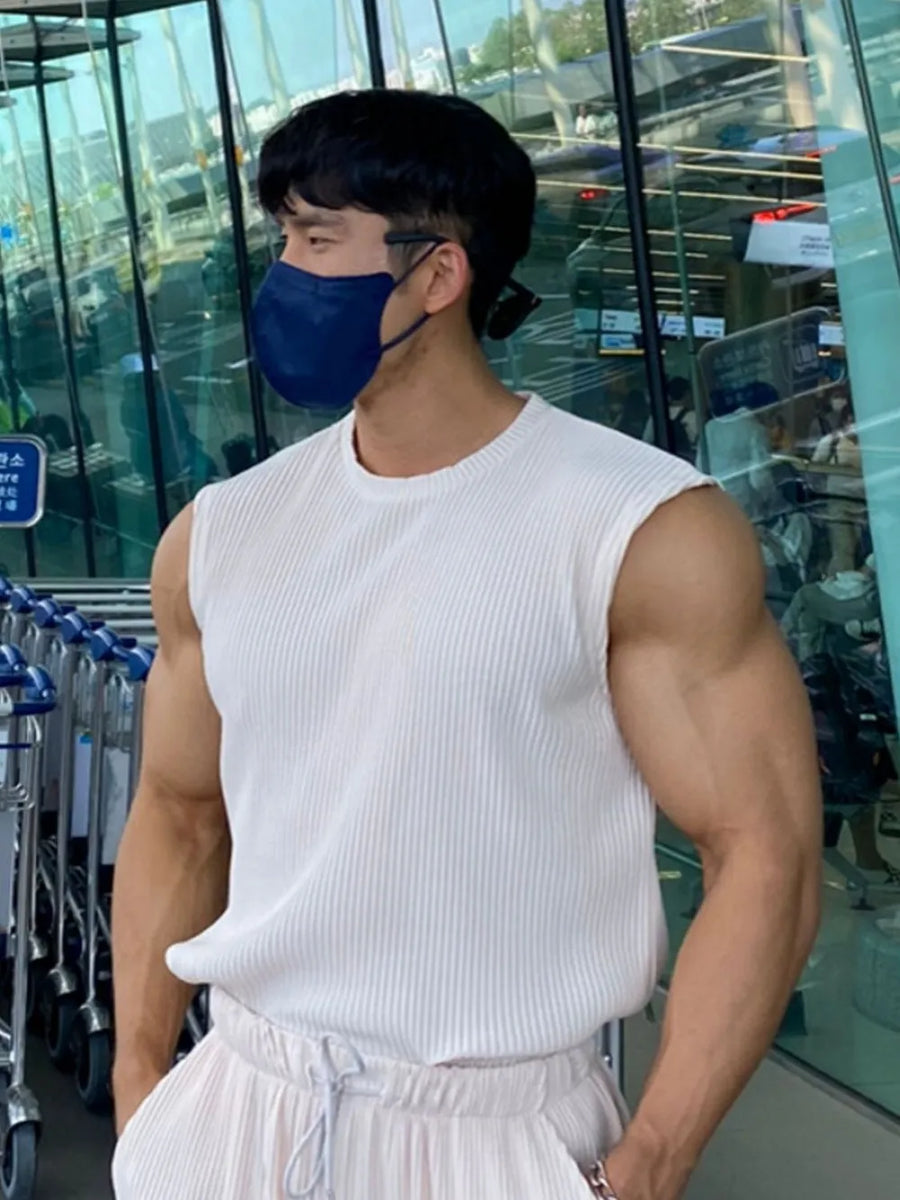 White ribbed sleeveless muscle tank top with a crew neck.