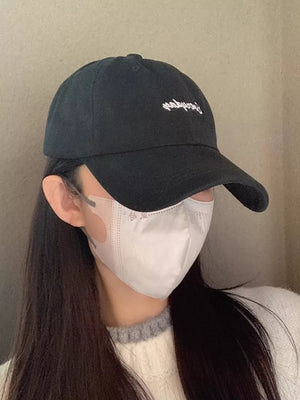 Black cotton baseball cap with white embroidered logo detail