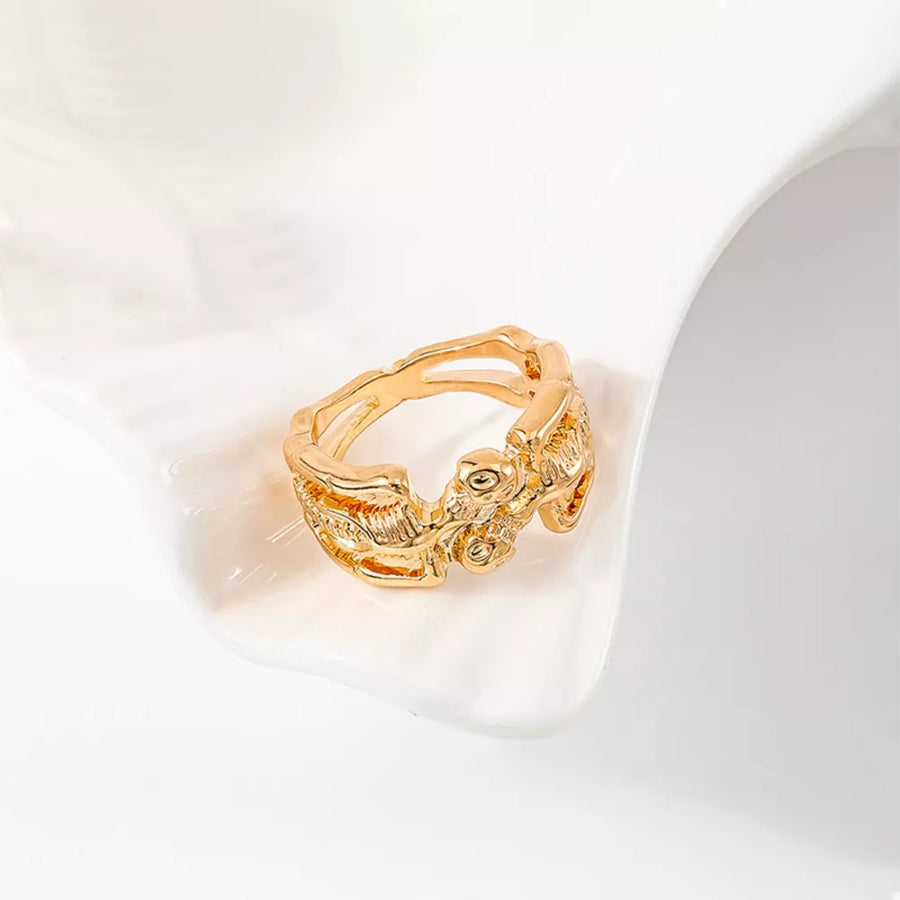 Silver ring featuring gold-plated and skull