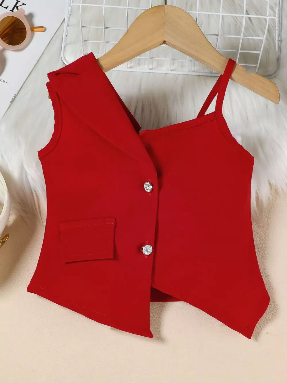 Red asymmetrical vest and skirtini set with rhinestone buttons and a faux pocket.