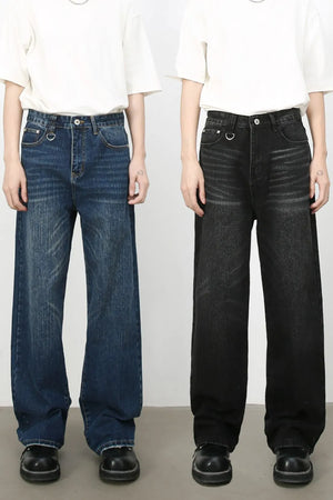 Wide leg distressed denim jeans in medium and dark washes with cat's whisker detail.
