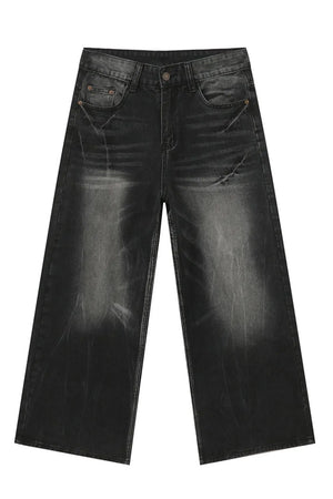 Whiskered wide leg denim jeans in dark wash with a relaxed fit and distressed details.