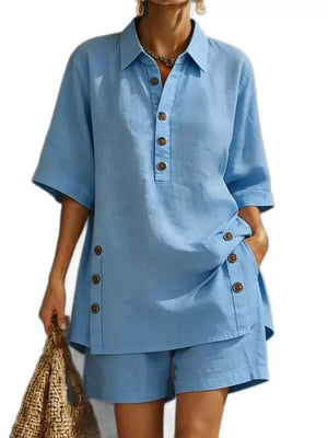Blue linen shorts with button details and a matching collared shirt.