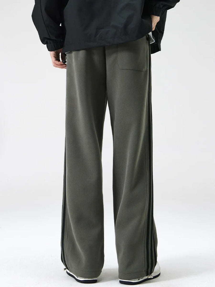 Men's army green sweatpants with black side stripes and a back pocket.