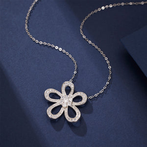 clear necklace featuring flower pendant and floral