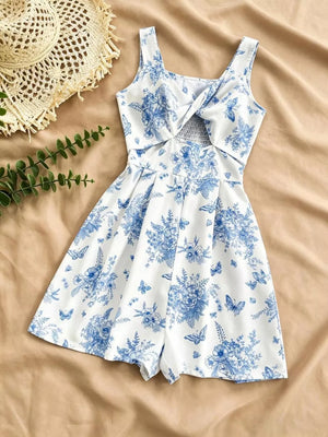 White floral print romper with blue flowers and butterflies, twist front, cutout, smocked waist.