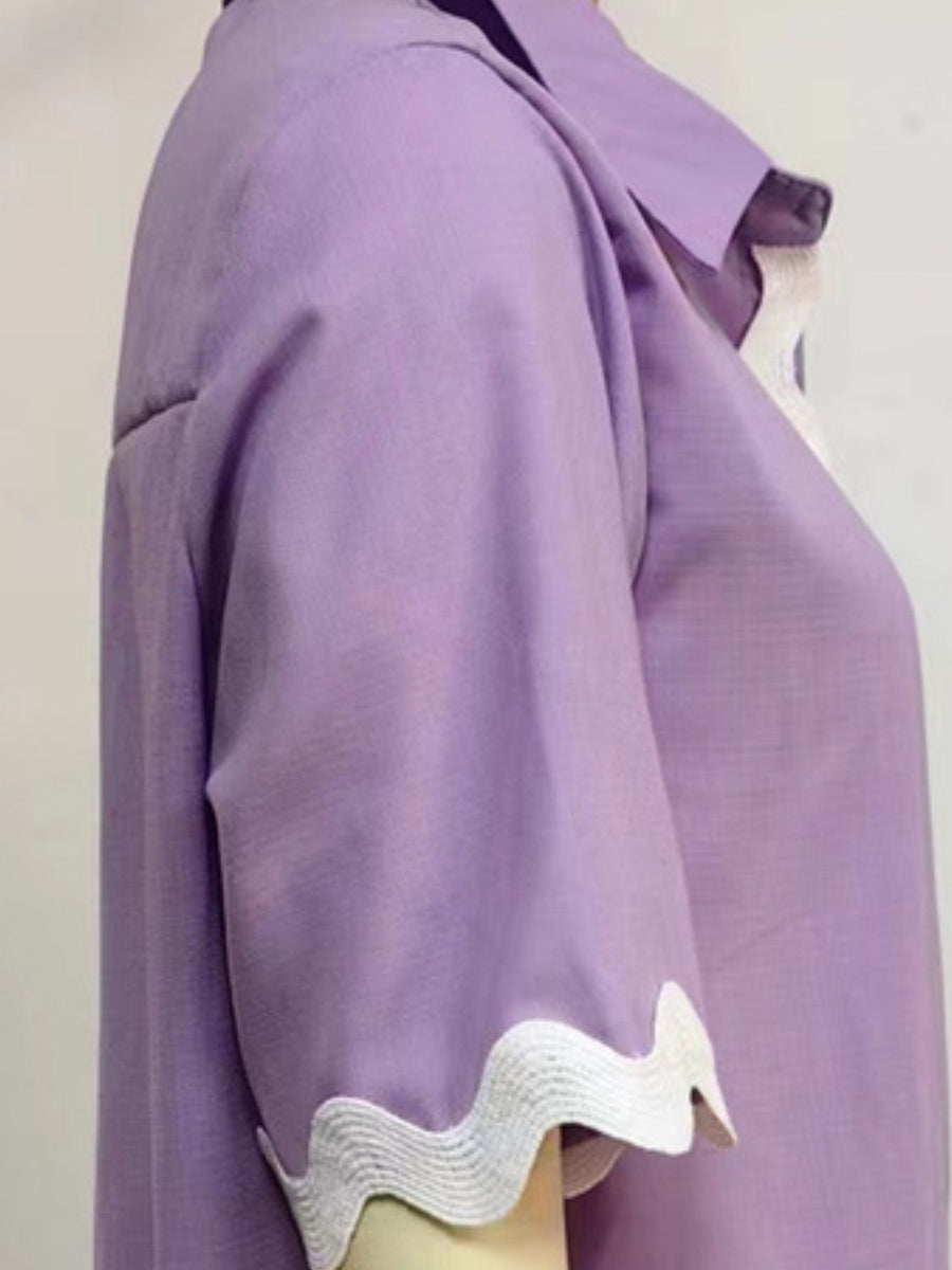 Lilac linen pajama top with scalloped trim on the sleeves and neckline.