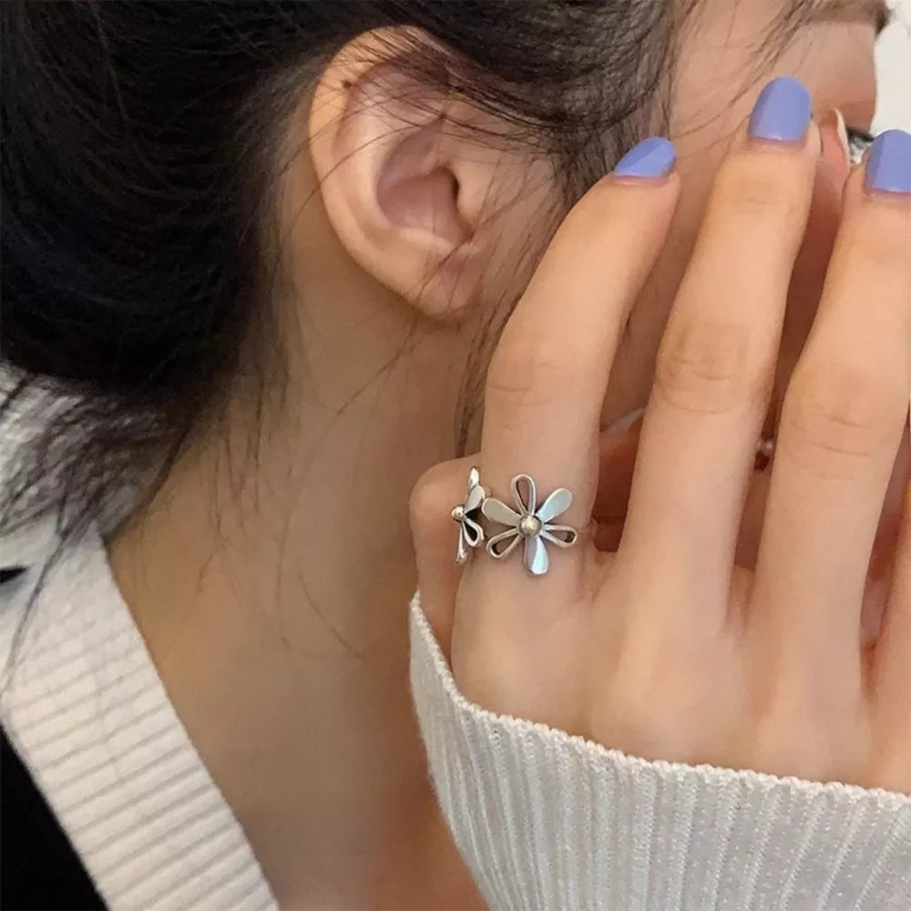 silver ring with floral and not applicable