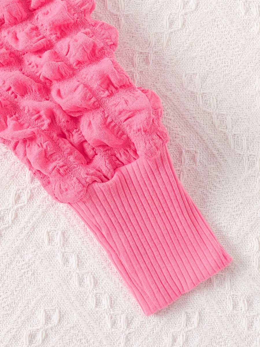 Pink baby dress with bubble texture and ribbed cuff