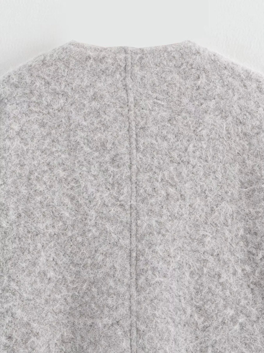 Textured knit tie-front coat in silver gray, showing back seam detail.