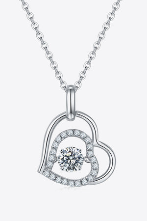 Silver floating diamond heart necklace with a central sparkling stone and pavé-set accents.