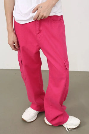 Electric pink baggy cargo pants with multiple pockets and a relaxed fit.