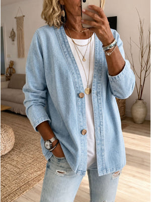 denim jacket in light blue featuring button-front and relaxed fit