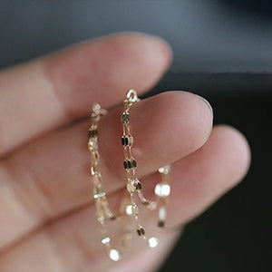 gold earrings with layered chains and not applicable