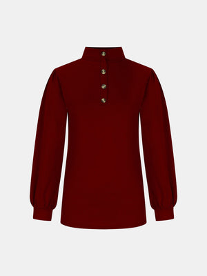 Burgundy mock neck top with button back detail and puff sleeves.