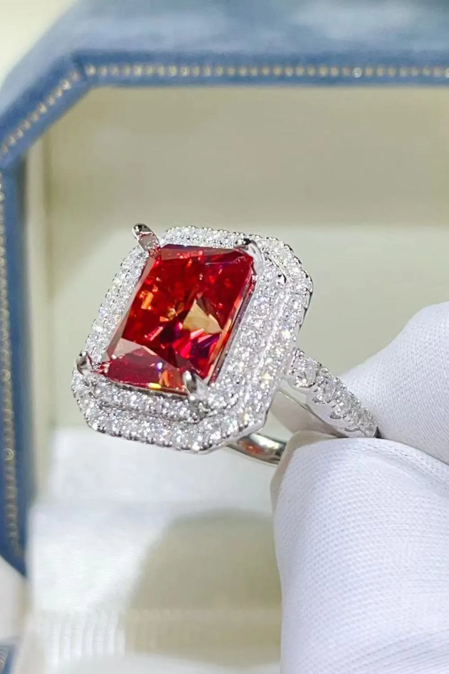 Radiant Ruby Halo Cocktail Ring in sterling silver with a large, faceted scarlet center stone surrounded by a double halo of