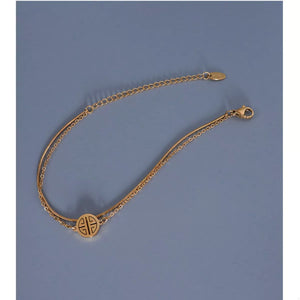 Gold double layered titanium steel bracelet with circular charm