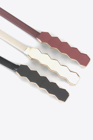 Geometric buckle waist belt in black, cream, and wine with gold trim.
