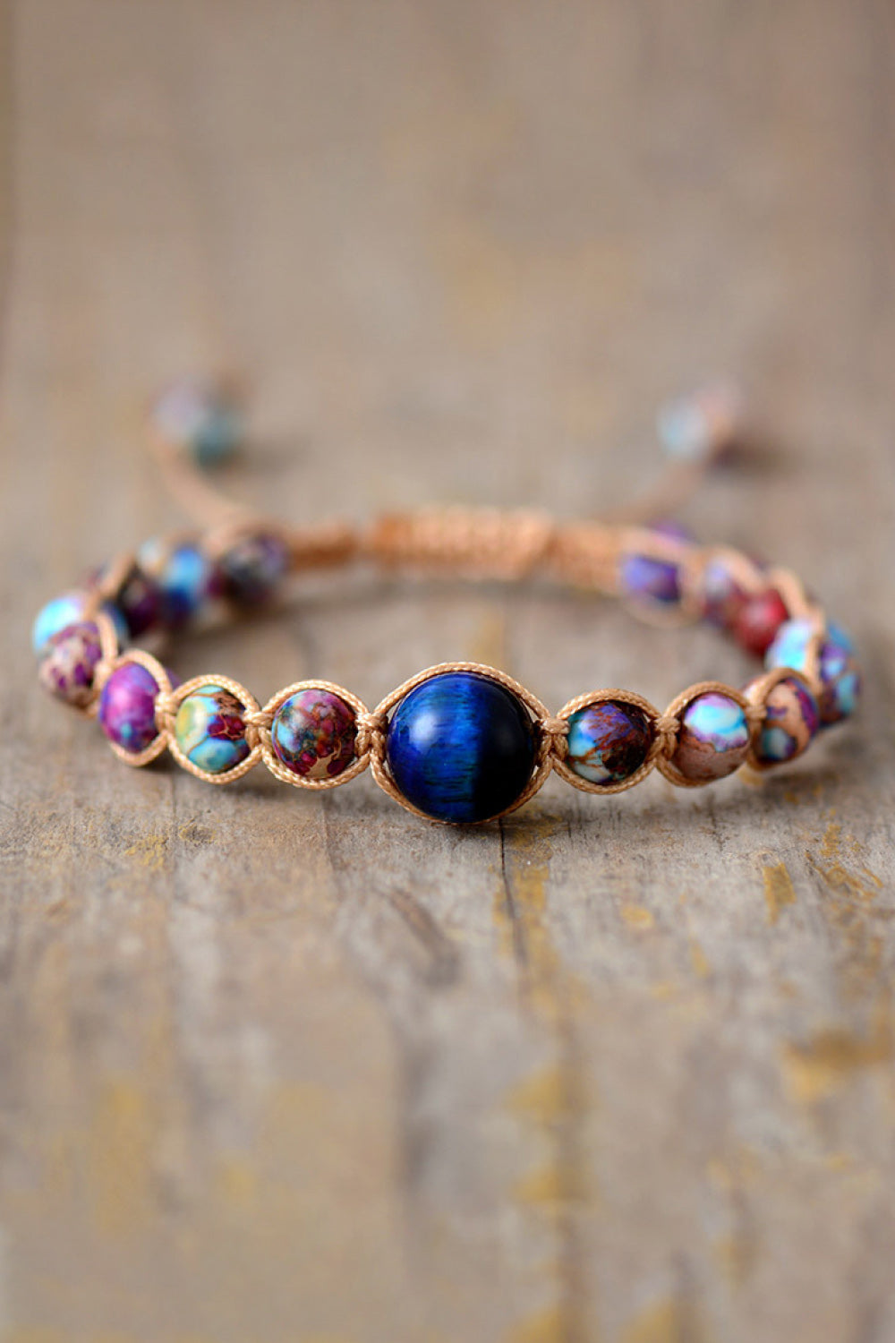 Bohemian jasper beadwork bracelet with multicolor beads and a central blue stone.