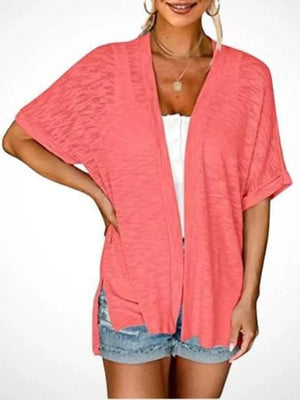 cardigan in coral pink featuring open front and relaxed fit