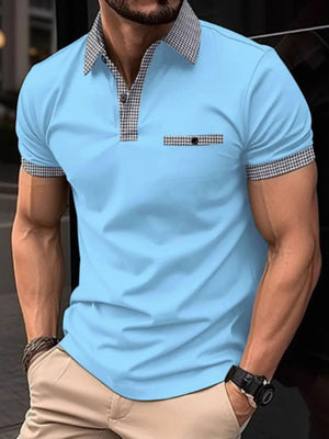 Pastel blue polo shirt with gingham trim on collar, pocket, and sleeves.
