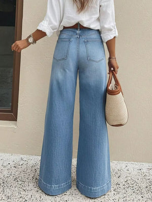 Light wash denim wide-leg jeans with pockets and a flared hem.
