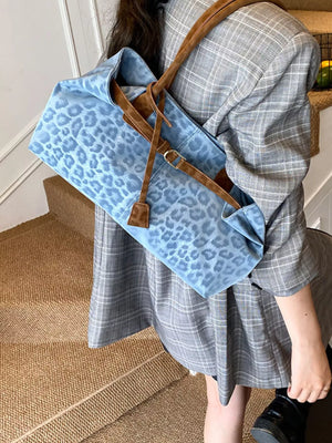 Blue leopard print PU leather shoulder bag with brown straps.