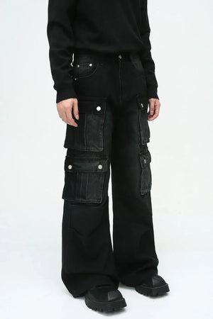 Dark denim wide-leg cargo pants with multiple utility pockets and silver button details.