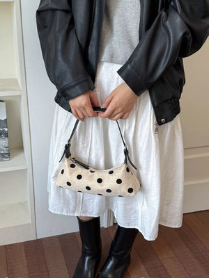 crossbody bag in black with polka dot and adjustable strap