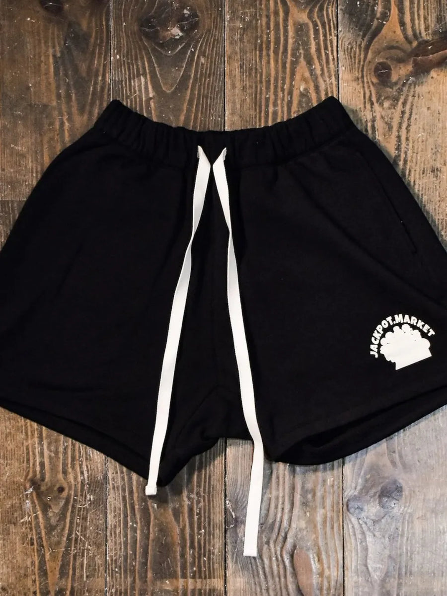 Black fleece jogger shorts with white drawstring and market logo detail