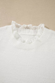 ivory pullover sweater with patchwork detail and long sleeve