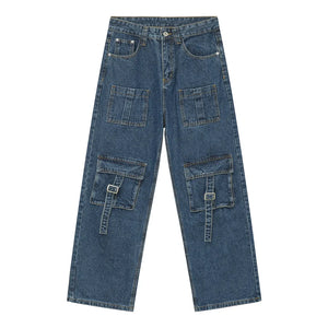 Medium wash denim cargo pants with buckle flap pockets and multiple utility pockets.