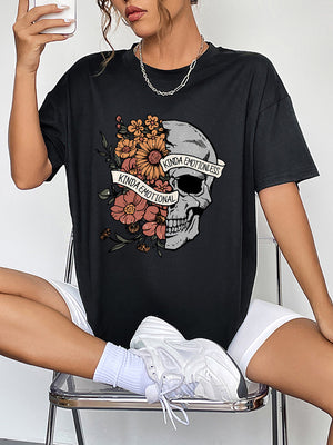 Black oversized tee with skull and floral graphic, featuring text "Kinda Emotional Kinda Emotionless".