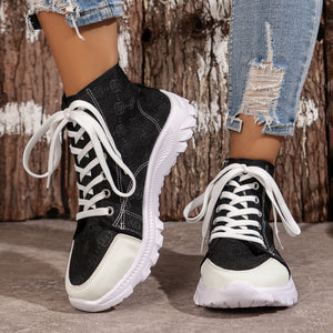 Black canvas high-top sneakers with white laces and chunky soles.