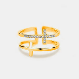 Gold double band ring with two cross embellishments, one with clear stones.