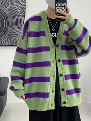 Oversized green striped V-neck cardigan with buttoned front.