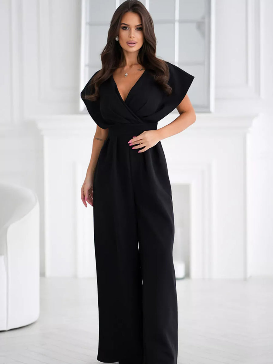 Black wide-leg romper with surplice neckline and flutter sleeves.