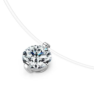 Silver floating moissanite necklace with clear illusion chain and 1 ct round diamond simulant.