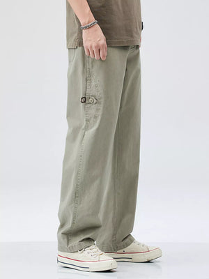Men's sage loose-fit cargo pants with utility pocket detail.