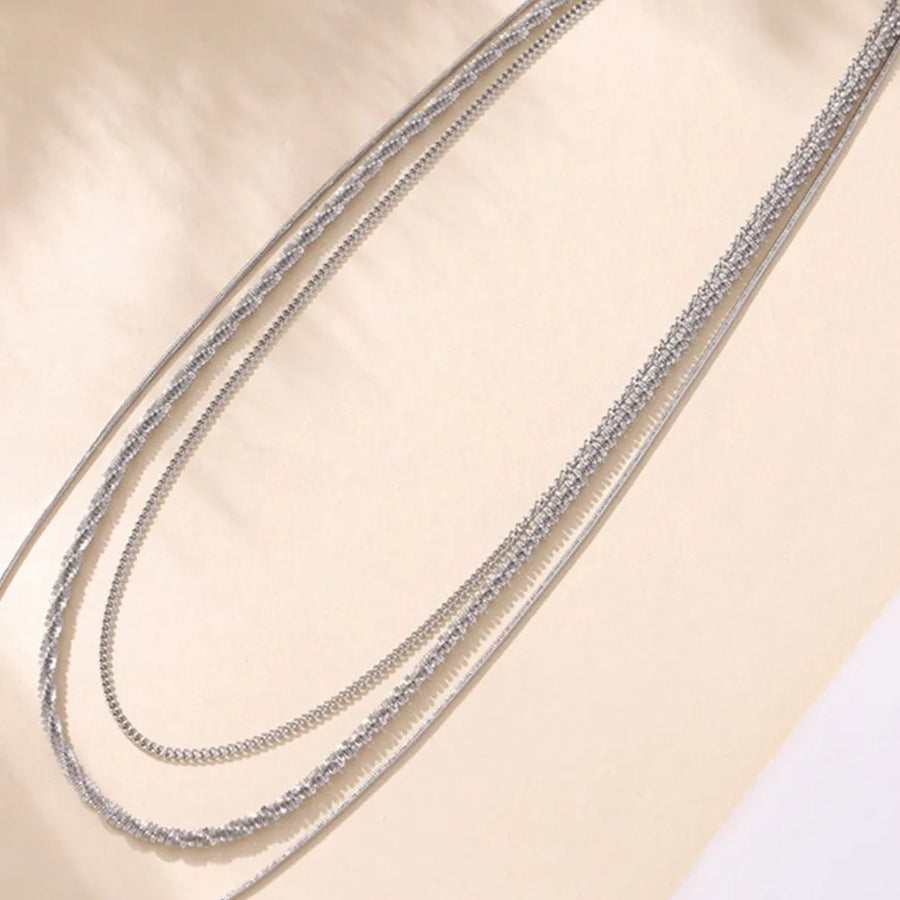 Delicate three-strand silver crystal necklace with layered chains