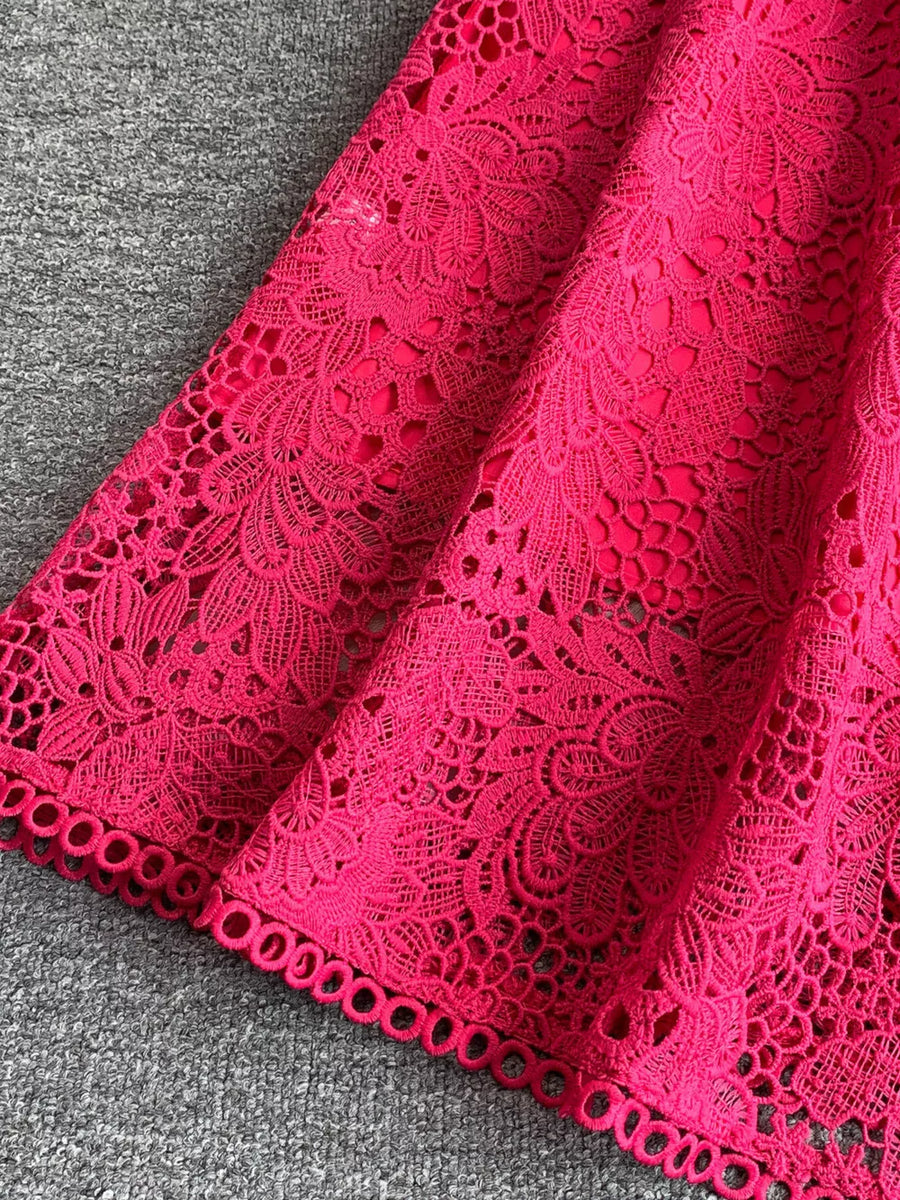 Fuchsia pink lace A-line dress with floral pattern and cutout detail.